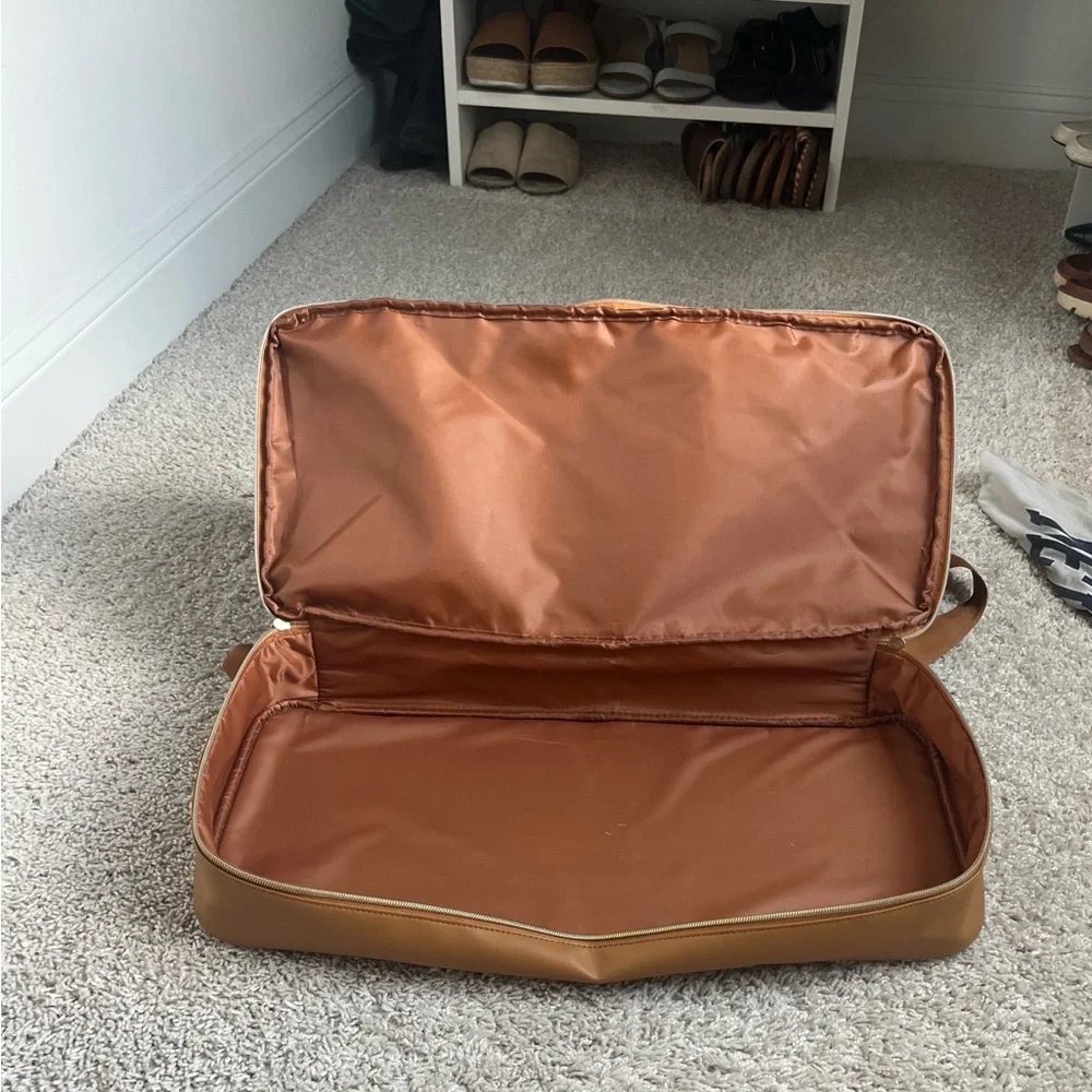 Stylish Navy and Tan carry on luggage with bottom storage